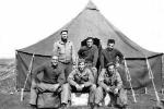 We are in Africa and have just received our first pyramidal tent and moved out of pup tents.  I am the one on the lower right.  Above me is Tony Guardabascio. Center upper is Nick Romanchuk. Center first row I believe is Dave Slayton.